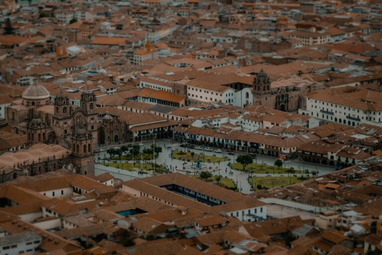 Drone view capturing the Plaza de Armas, Cusco, with its historic architecture and vibrant cityscape.