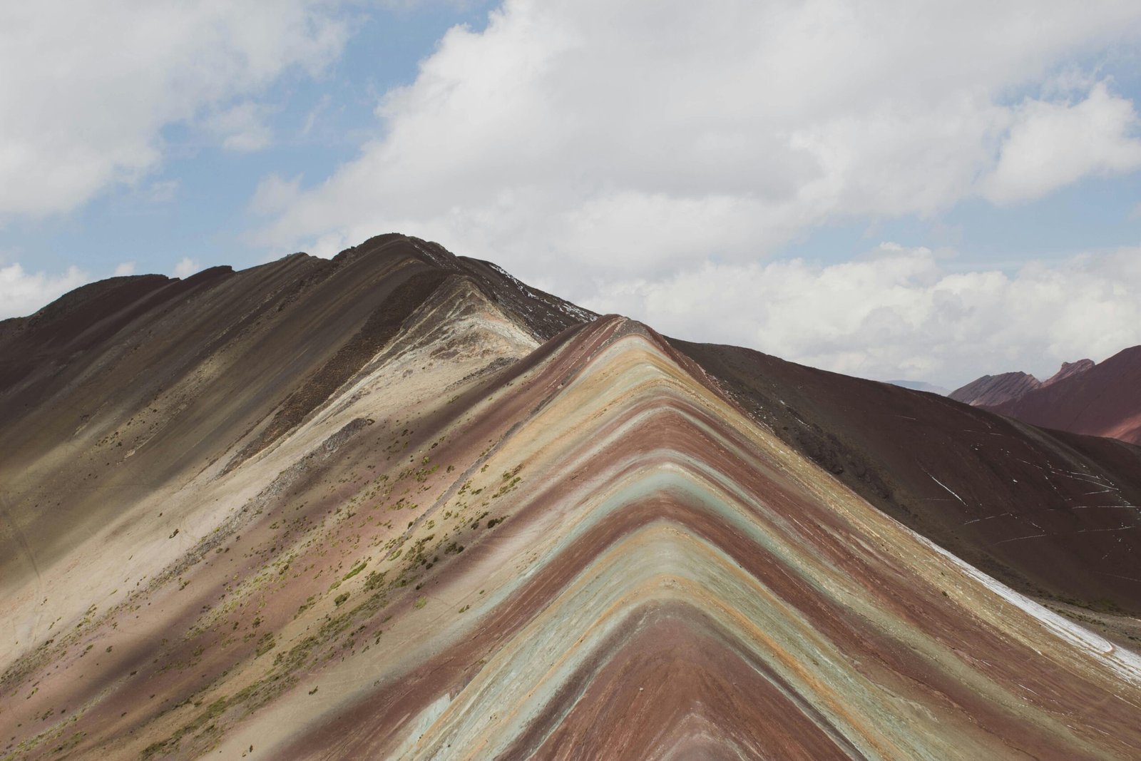 Stunning view of Rainbow Mountain Vinicunca's colorful slopes, captured in the Andes of Peru.
