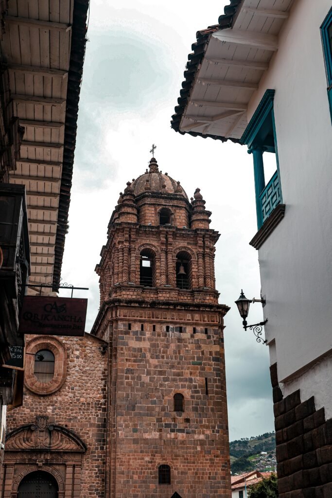 Capture of a historic church bell tower in the vibrant city of Cusco, Peru. Architectural beauty.