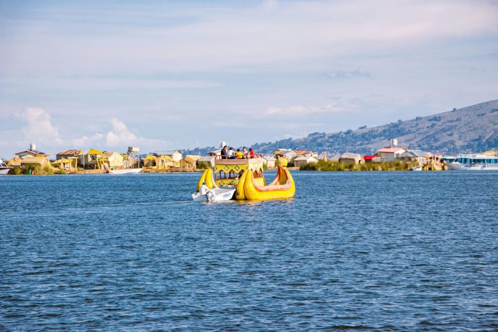 Vibrant scene of reed boats navigating Lake Titicaca near the Uros Floating Islands in Peru.