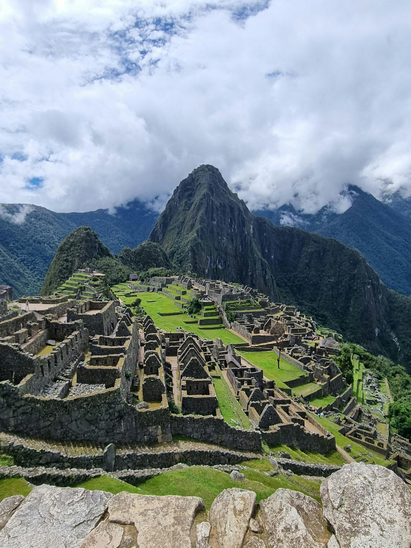Explore the ancient ruins of Machu Picchu with stunning views of the Andes Mountains.