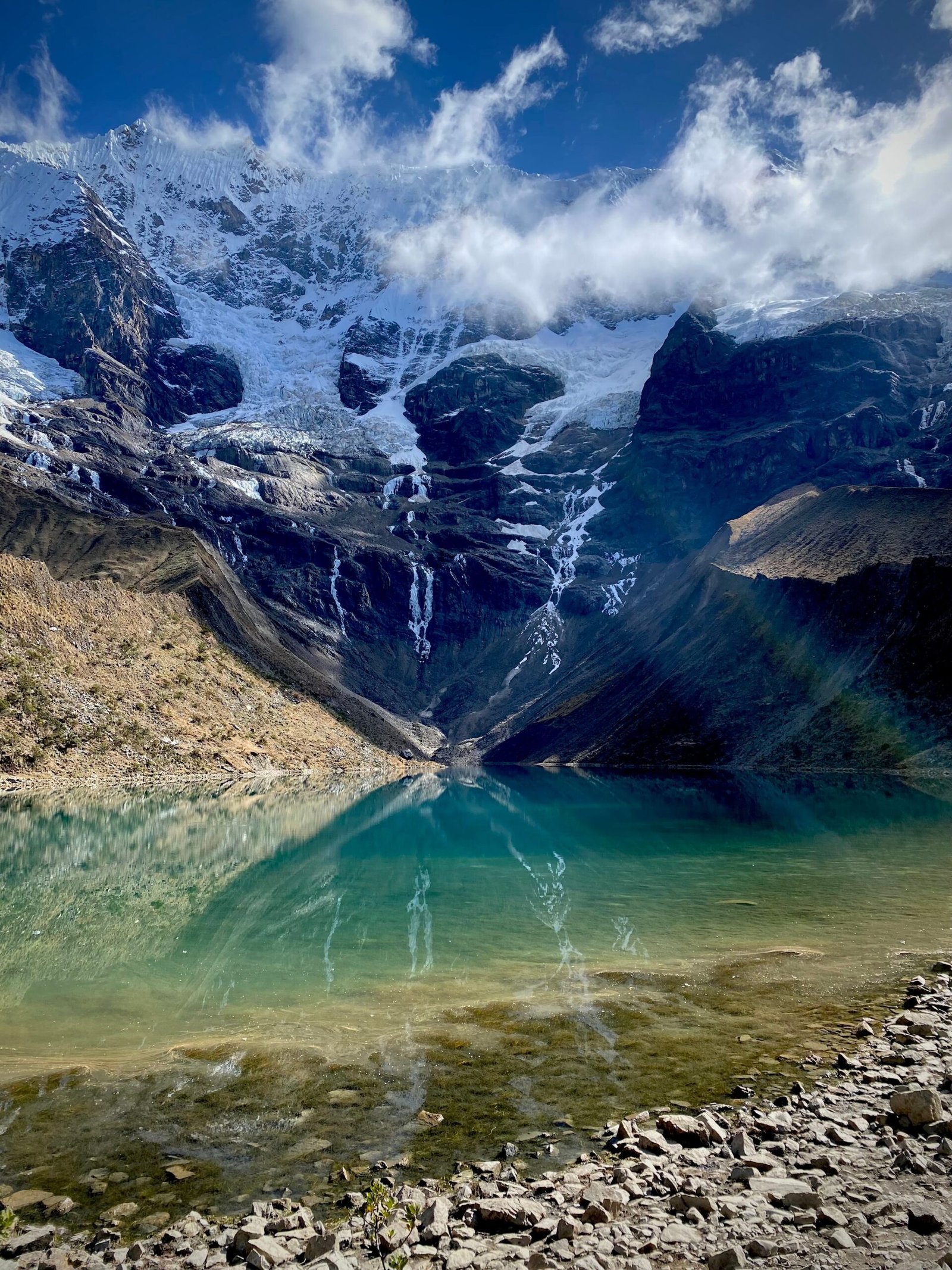 Stunning view of Humantay Lake with snow-capped mountains in Cusco, Peru.